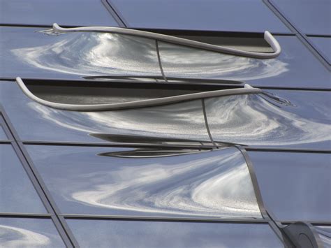 Veiled in Brilliance: How Reflective Facades Have  